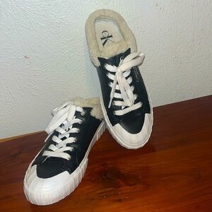 Calvin Klein Jeans Veronik black faux Leather mules. faux fur lined